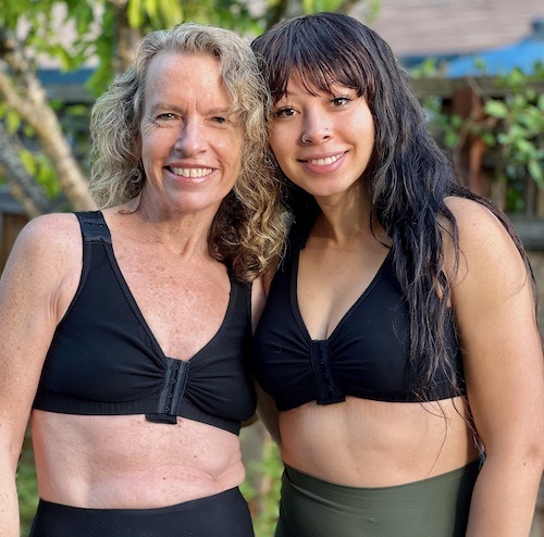 Two smiling women wearing BraLisa's seamless, wireless, organic cotton bra with front closure and adjustable straps; for breast surgery recovery and women seeking a true comfort bra.
