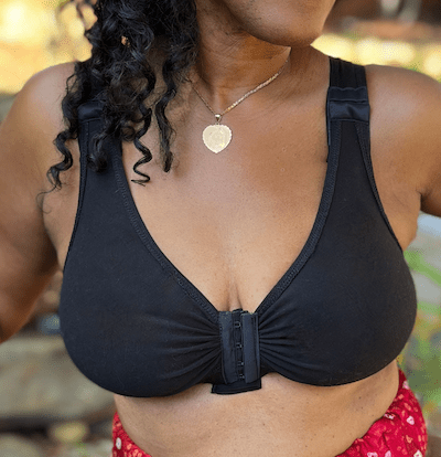 A woman wearing BraLisa's seamless, wireless, organic cotton bra with front closure and adjustable straps; for breast surgery recovery and women seeking a true comfort bra.