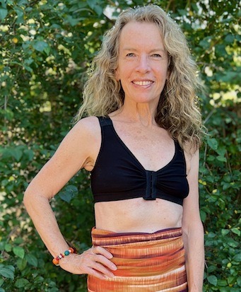 A woman wearing BraLisa's seamless, wireless, organic cotton bra with front closure and adjustable straps; for breast surgery recovery and women seeking a true comfort bra.