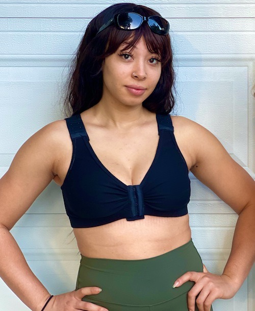 A woman with sunglasses wearing BraLisa's seamless, wireless, organic cotton bra with front closure and adjustable straps; for breast surgery recovery and women seeking a true comfort bra.
